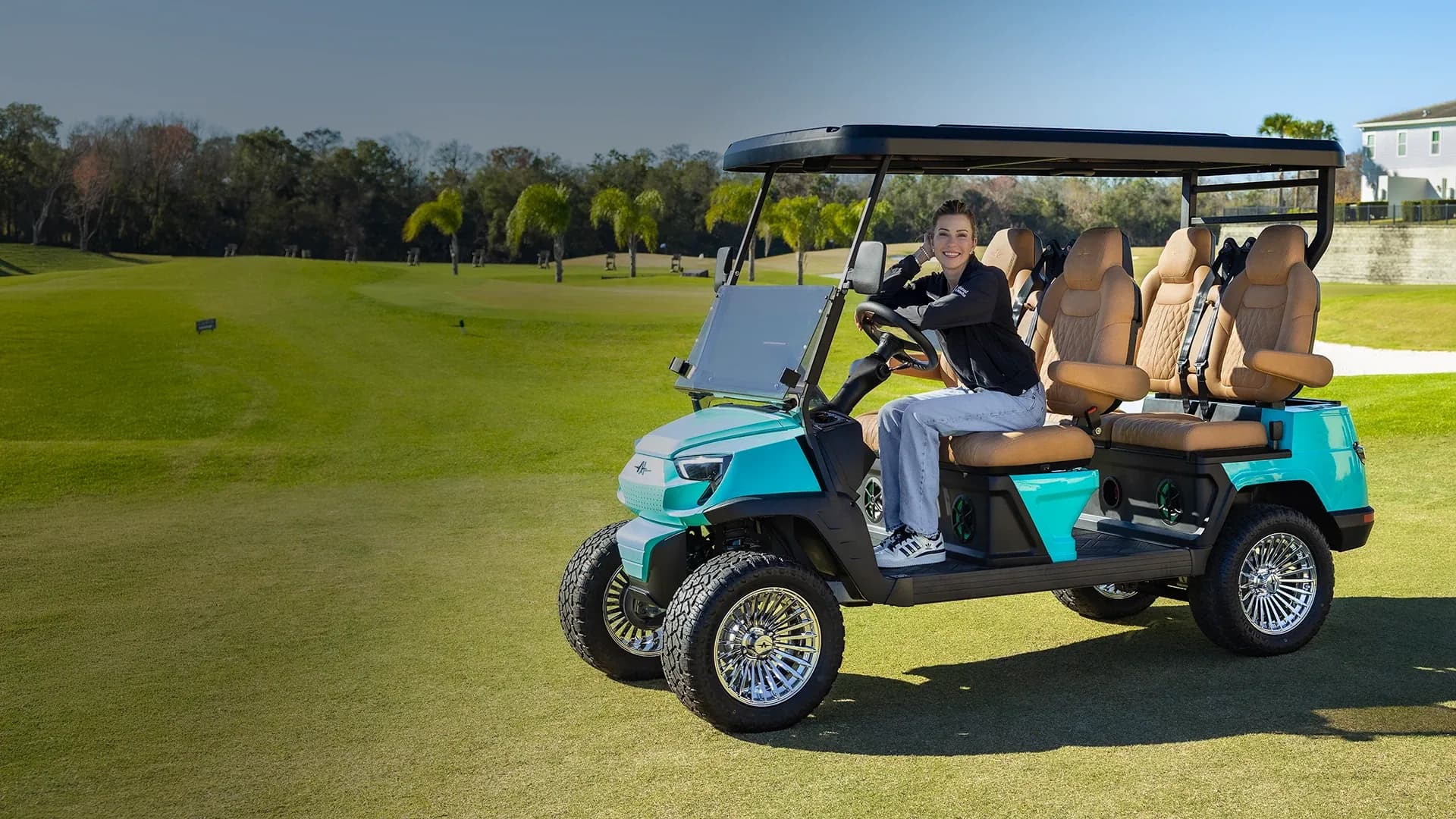 Six-seater lifted lithium golf buggy on an Australian fairway